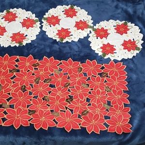 Christmas poinsettia table runner with 5 doilies by St. Nicholas Square.